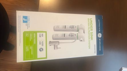 That’s a GE GXK255TBN under-sink dual stage water filtration system.