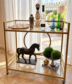Elegant Gold Bar Cart with Decorative Glass Shelves