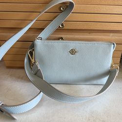 Beautiful Nannette Lepore crossbody bag in a soft light blue color with gold-tone hardware.