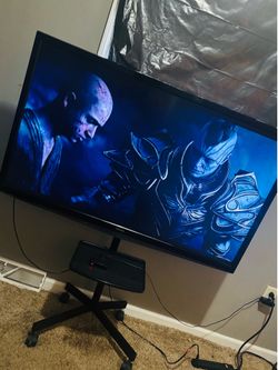 55inch Flatscreen with tv stand and Roku express 4K+