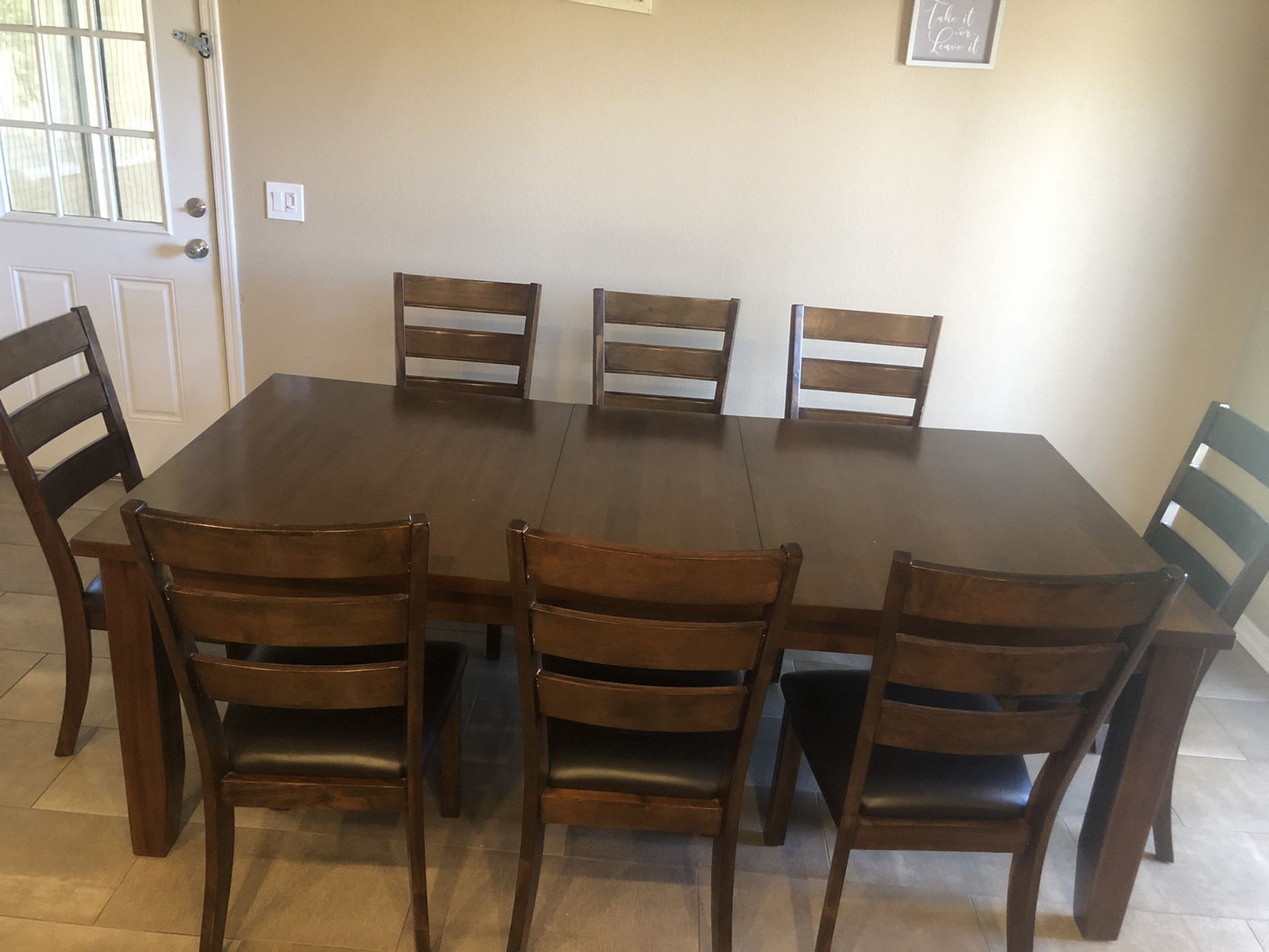 Dark solid wood table with 8 chairs