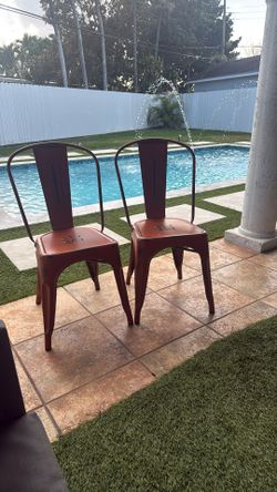 Two Orange Metal Chairs $70
