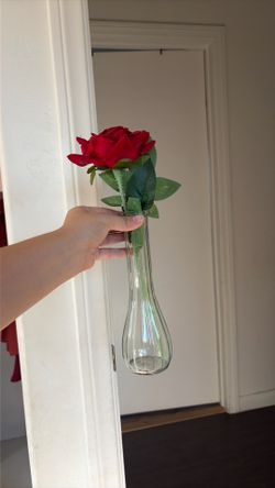 Artificial rose and vase