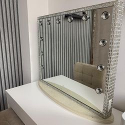 Lighted makeup mirror.