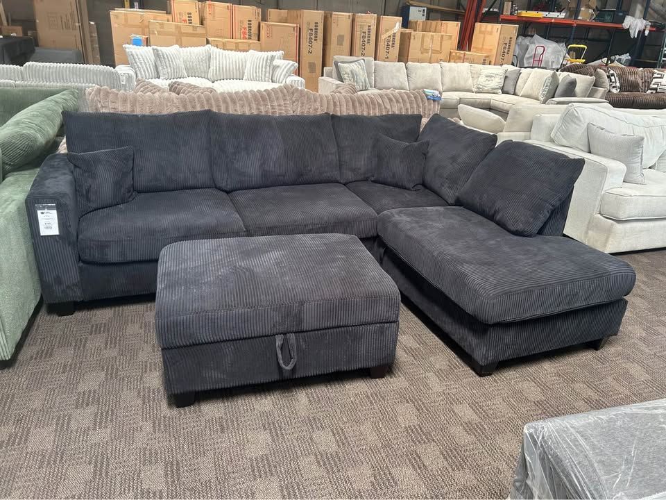 Black corduroy sectional w/ storage ottoman