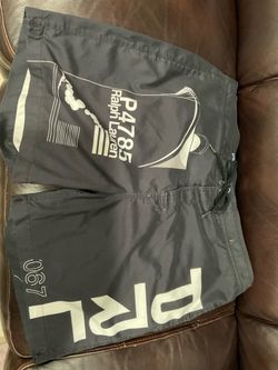 Polo Ralph Lauren black swim shorts with white graphic featuring 'P4785 Ralph Lauren'. Size XL