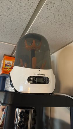 Baby bottle sterilizer & dryer .