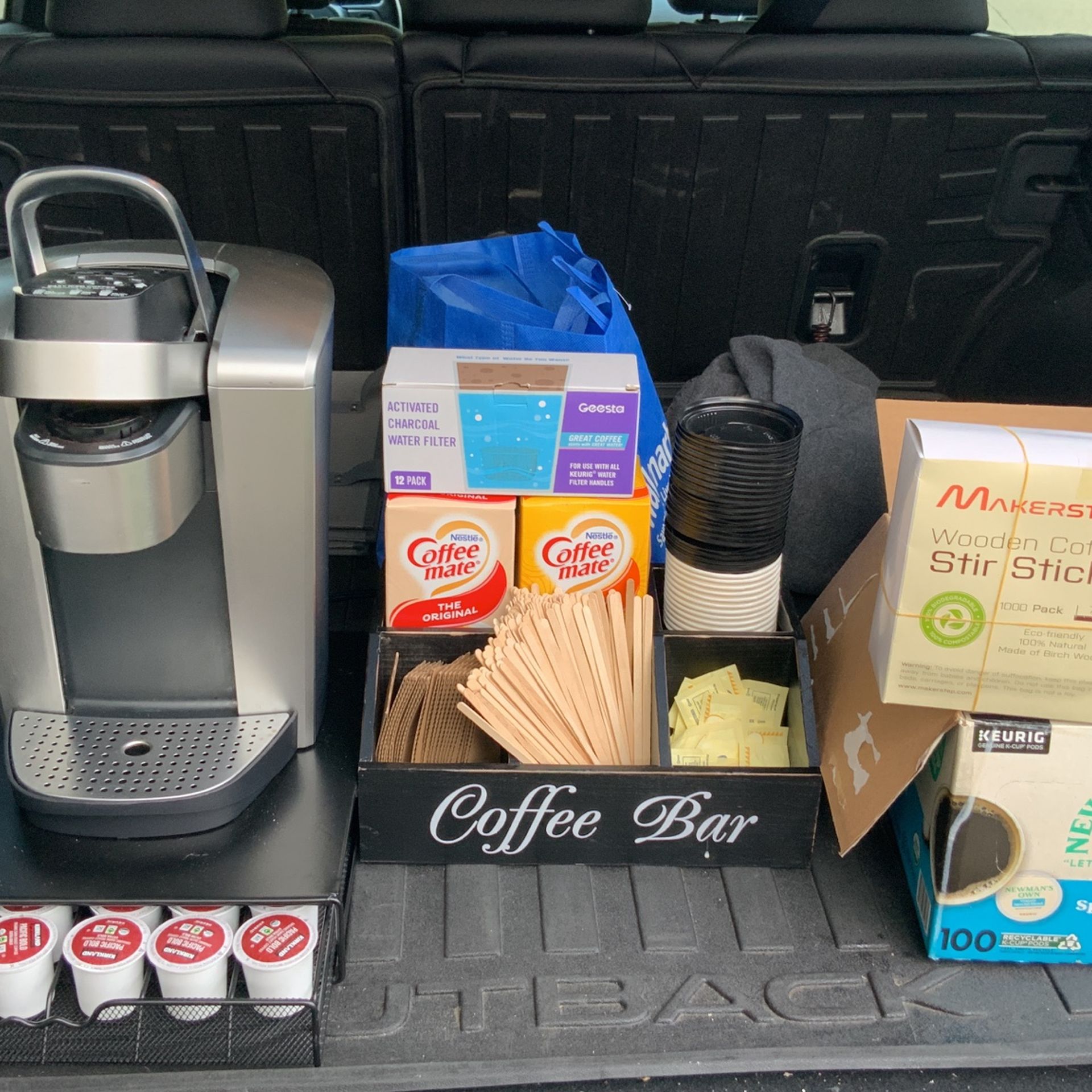 Kuerig Coffee Machine With Coffee Bar And Condiments