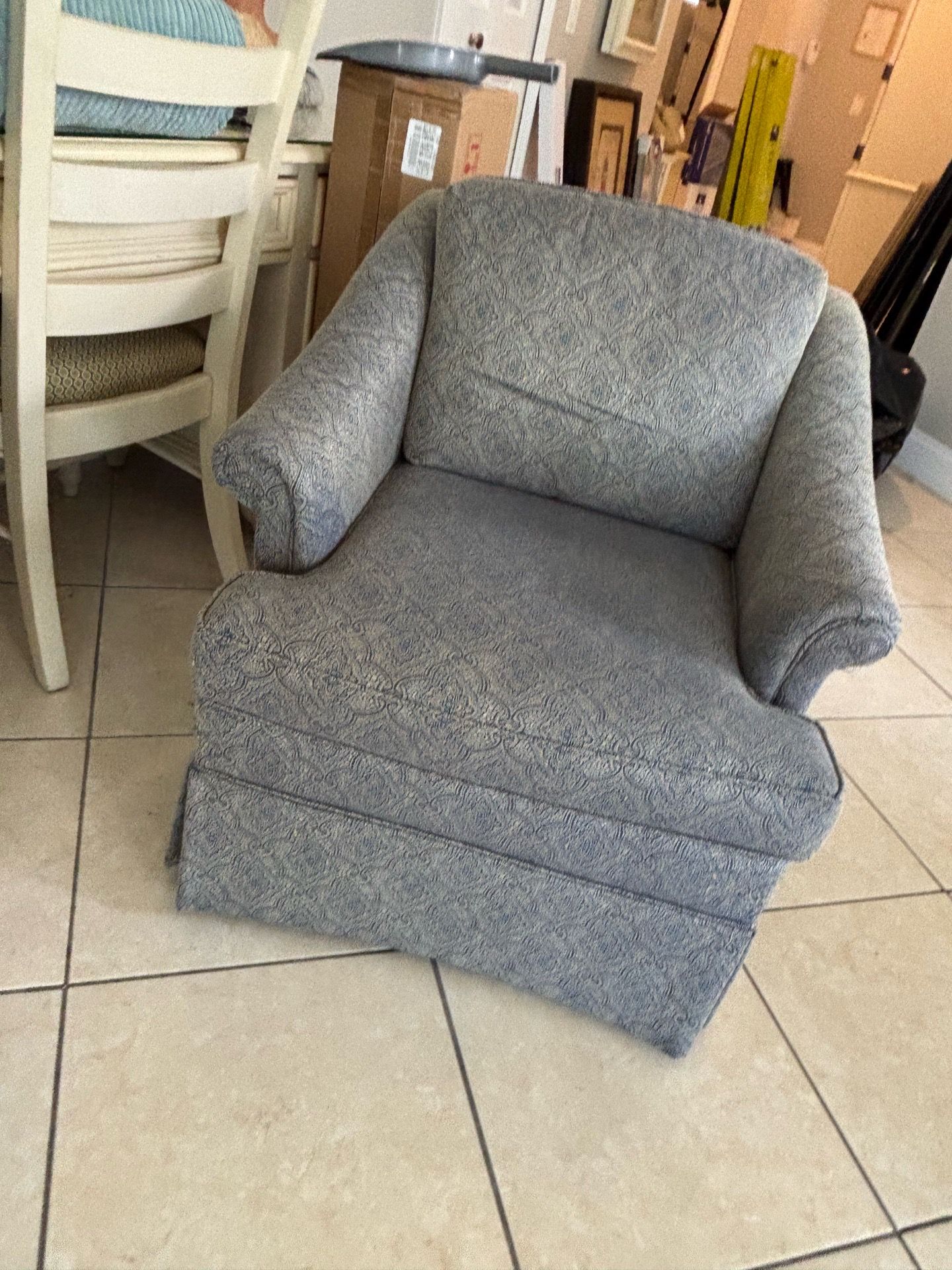 Upholstered skirted arm chair