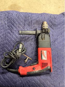 HEAVY DUTY, MILWAUKEE, HAMMER DRILL, GREAT TO DRILL INTO CEMENT, METAL OR WOOD.$60.00 OR BEST OFFER.