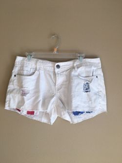White ripped shorts