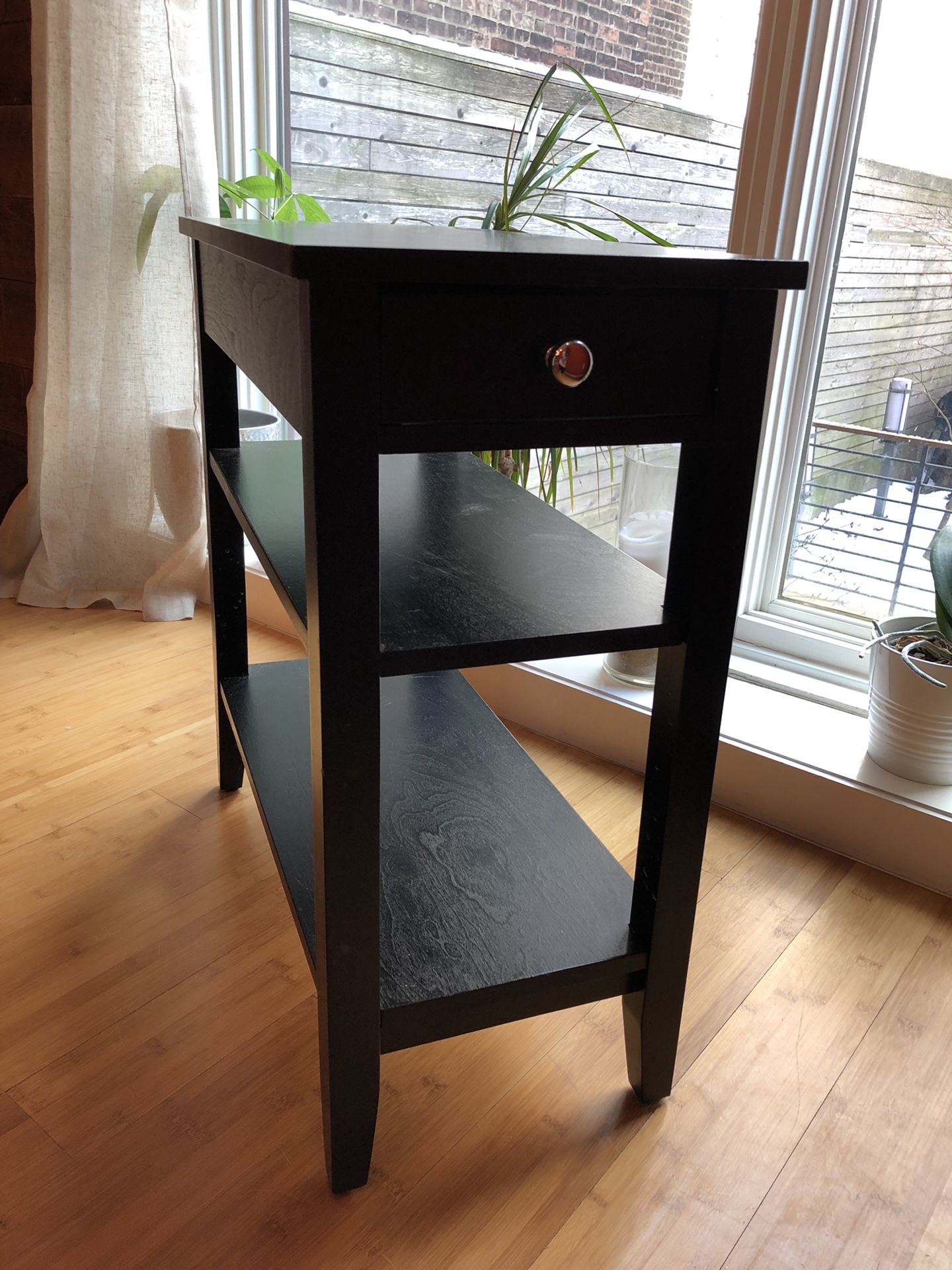 Black wood end table. Good condition.