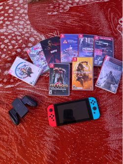 Nintendo Switch with games and controller grip