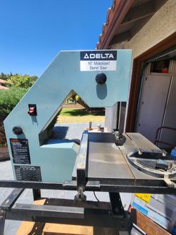 Delta 16 in. Band saw with rolling  stand