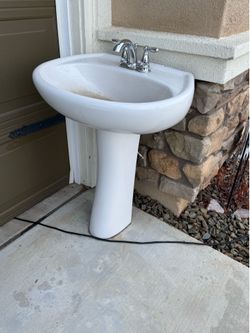 Bathroom sink with pedestal and all hardware