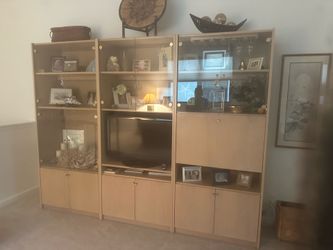 Wood bookcase with glass doors.