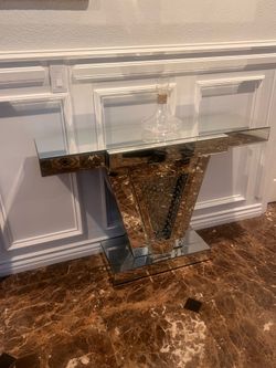 Glass console table with silver