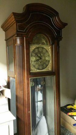 Howard Miller grandfather clock excellent condition with all original paperwork