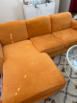Grey Couch with Orange Cover