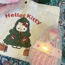 Hello Kitty, plushy spa headband, and make up brushes with a tote bag