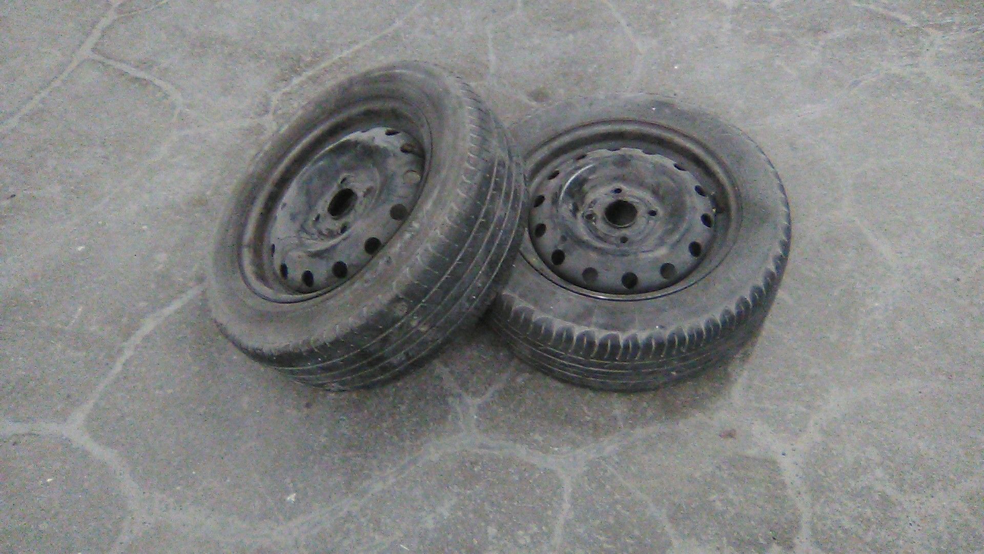 Two Kia Spectra wheels and tires 2005 to 2009
