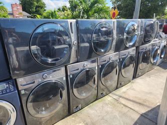 LG SILVER WASHERS AND DRYERS SET