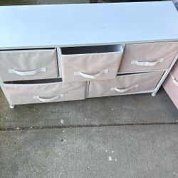 3 Pink And White Fabric Dressers