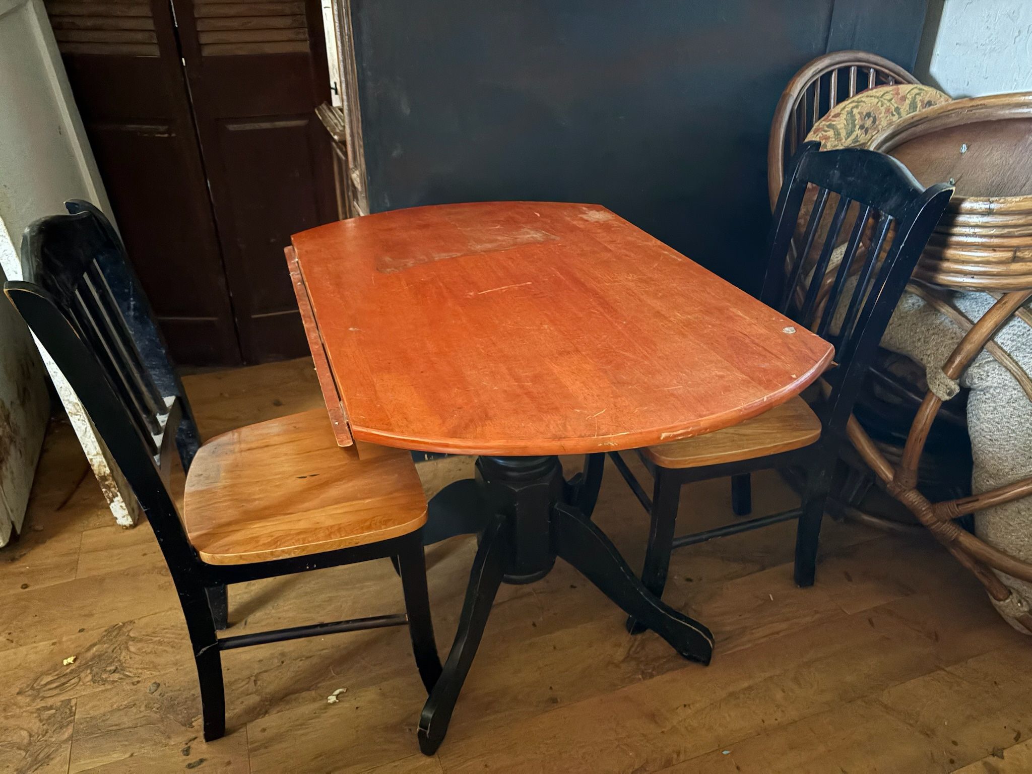 Table with Two Small Drop Leafs And Two Chairs