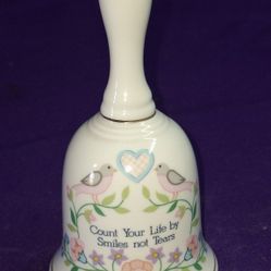 Vintage The Creative Circle Porcelain Jacobean Bell, which features a decorative floral design and the phrase "Count Your Life by Smiles not Tears".  
