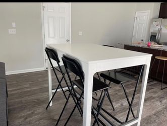 Dining table with chairs.