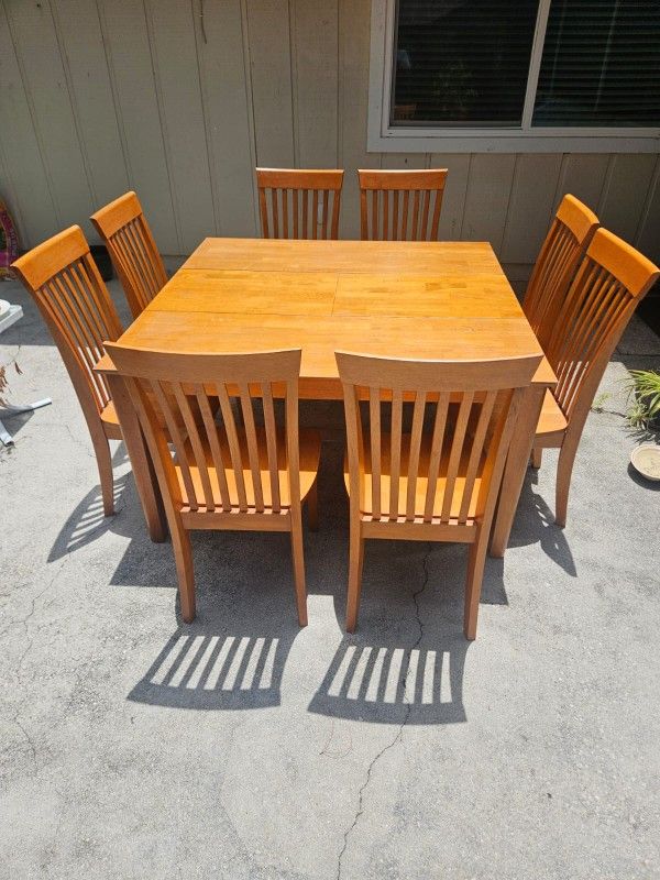 Wooden table and 8 chairs