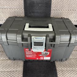 Husky 16-inch Plastic Portable Tool Box. It features heavy-duty, impact-resistant construction with a rugged metal latch and is designed to accommodat