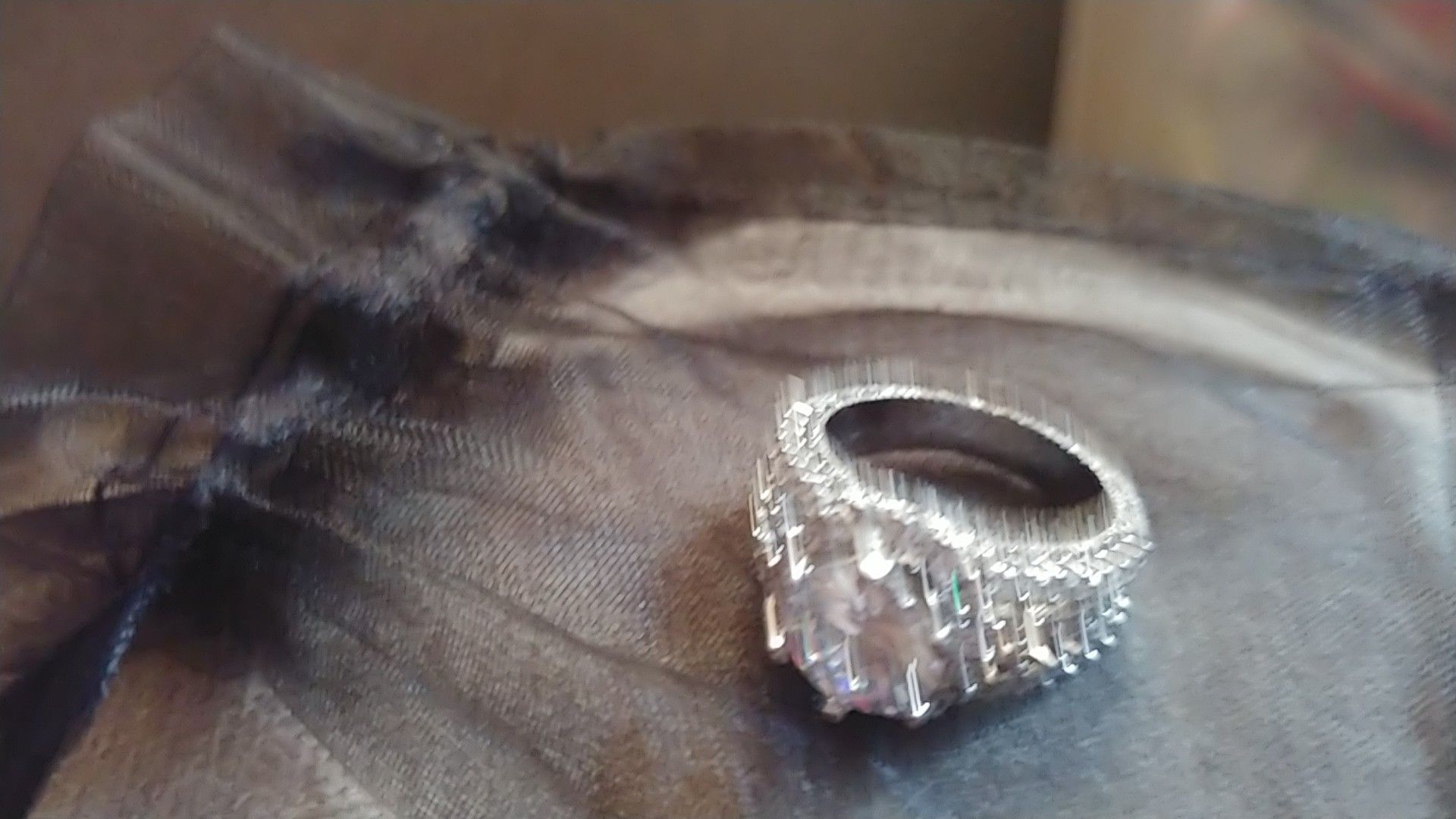 Woman's princess cut "Tiara" diamonds embedded in titanium engagement ring