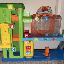 Fisher-Price Little People Light-Up Learning Garage Toddler Playset with Lights & Music