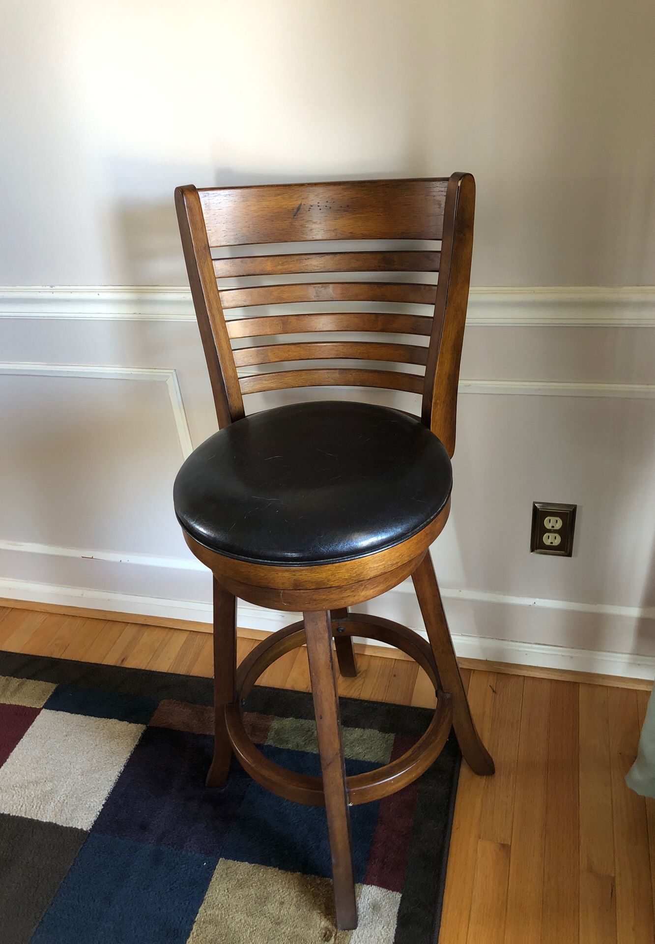 Two solid wood high table leather and oak chairs