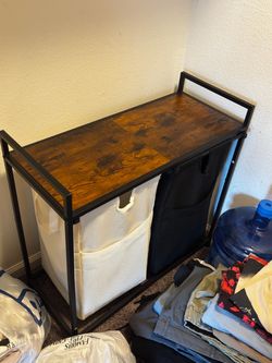 Double laundry basket with top shelf and carry able bags