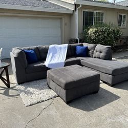 Free delivery Ashley Furniture gray 2-piece sectional couch with large ottoman retails $1250