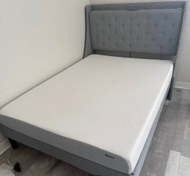 Full size bed with mattress.