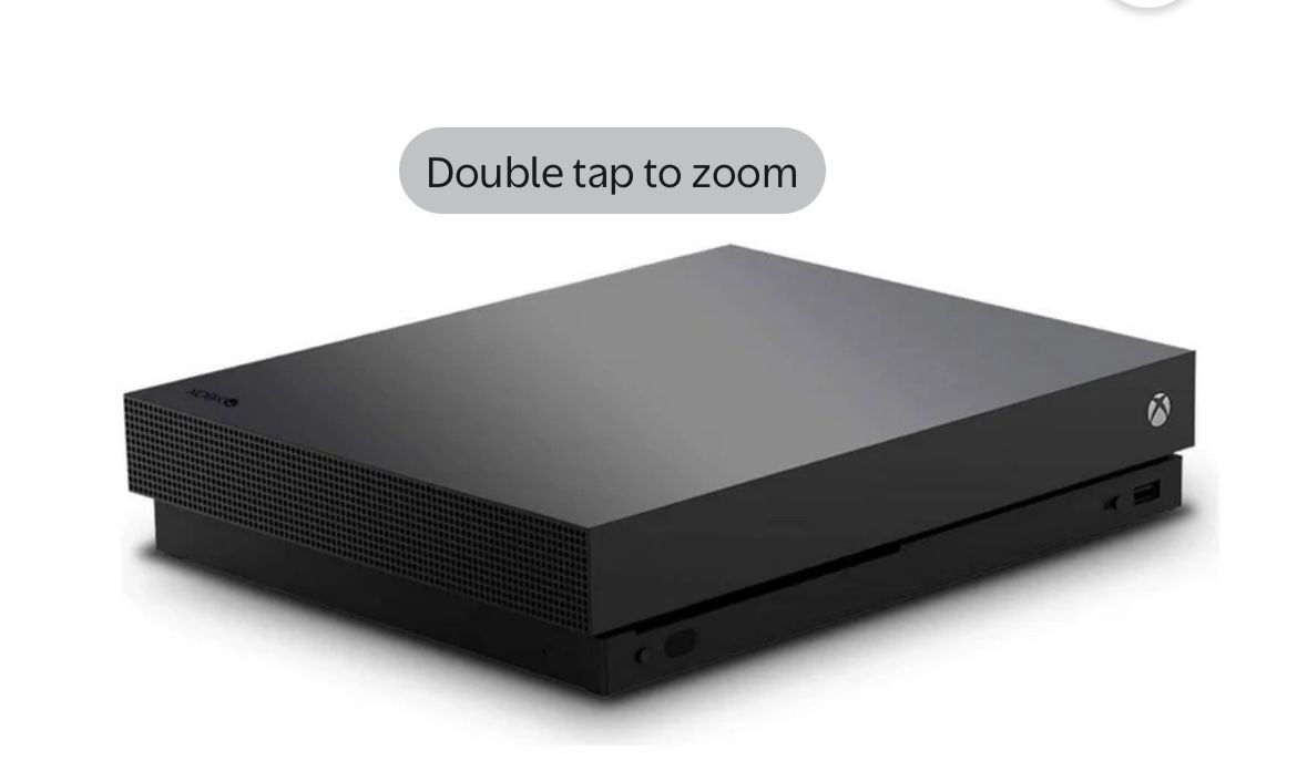 Xbox One X And Two Controllers