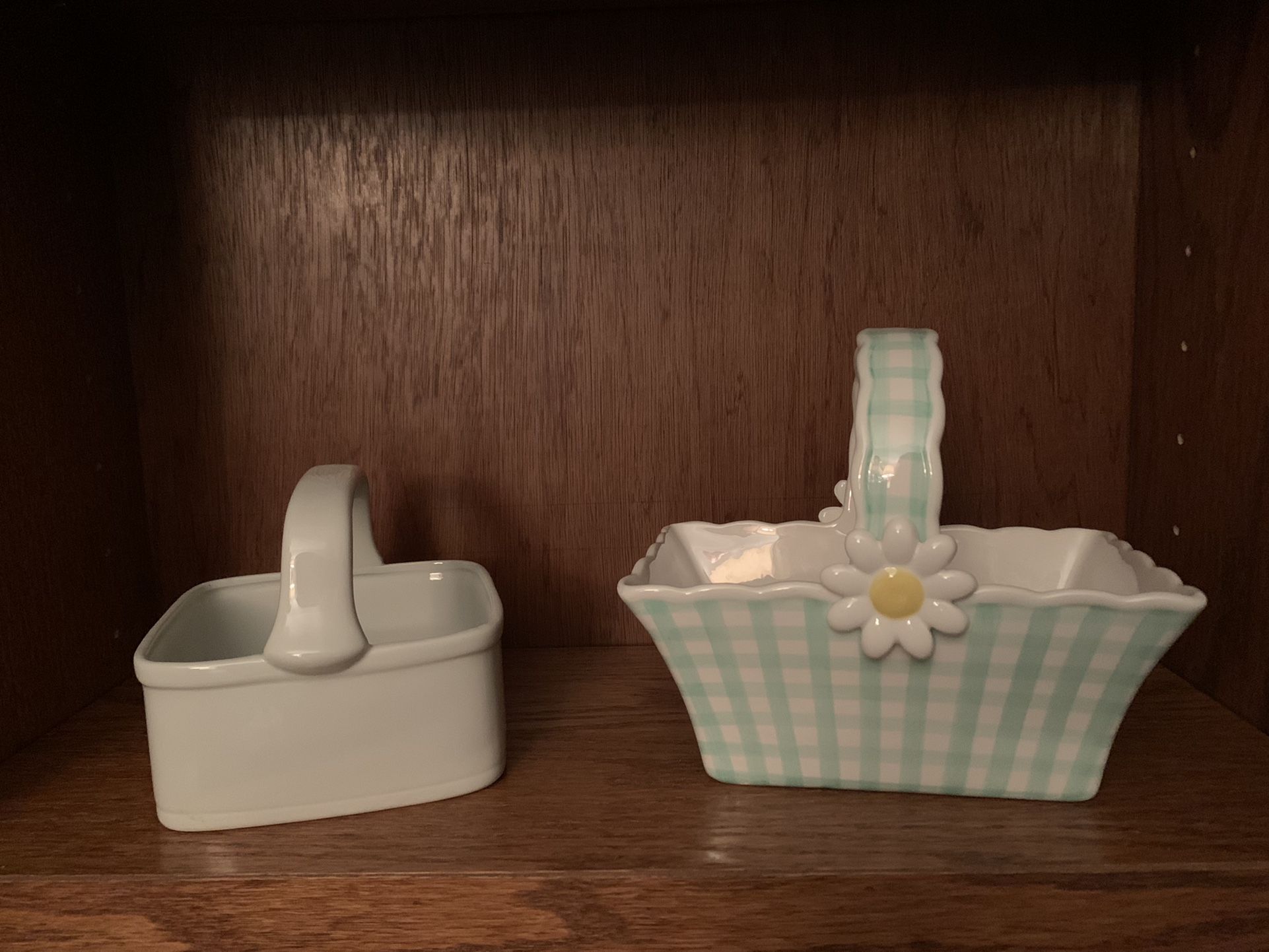 2-Ceramic Baskets….White one is approx. 5.3/4”x5.3/4” square x 5”H..2.1/2” deep…green/white/check is 8.1/2”Wx5.1/4”across..7”H and 3.1/4” deep.
