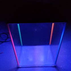 8 gallon fish tank with 7 color changing led lights and filter system also comes with supplies/food.