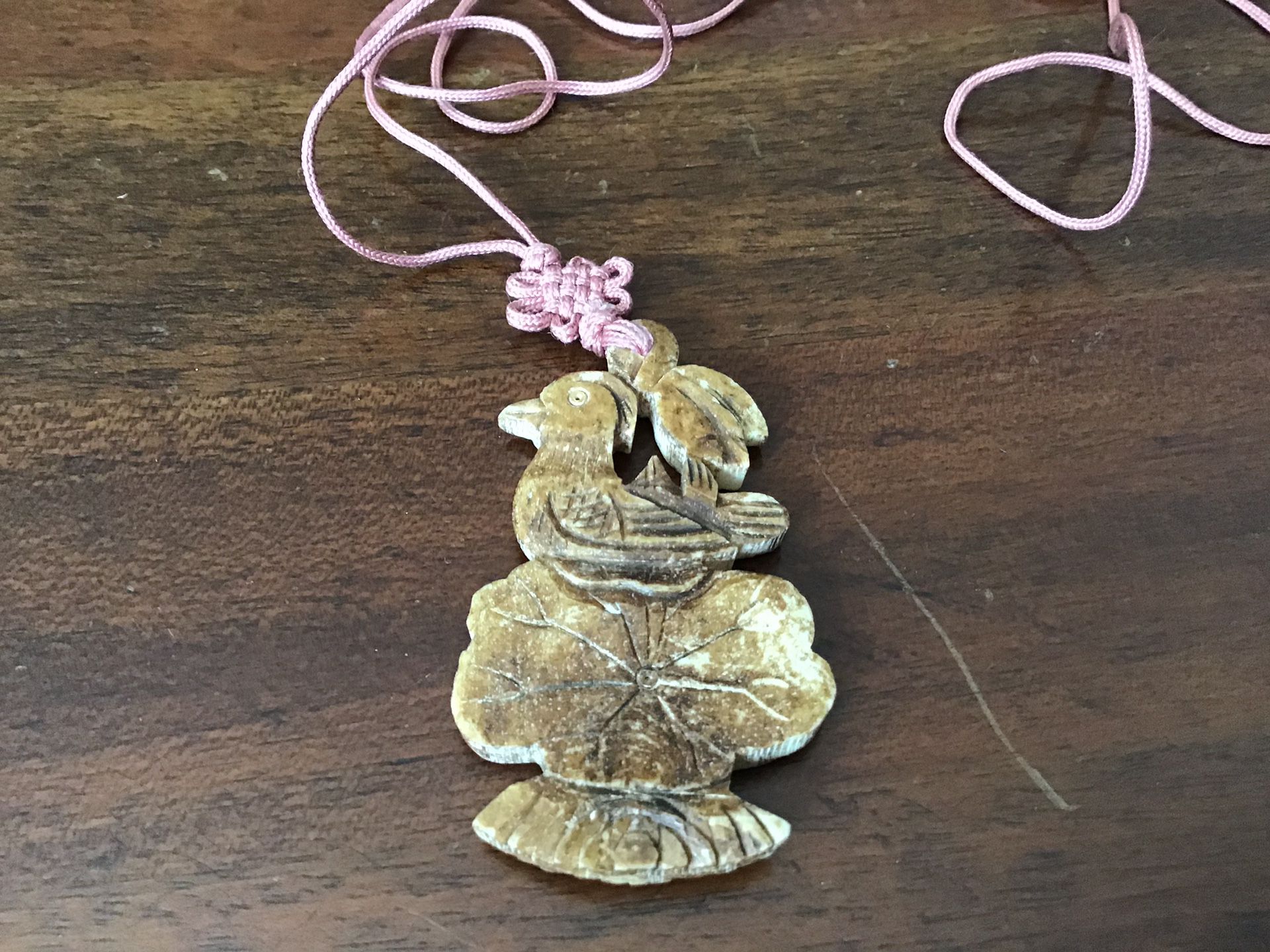 Carved bird pendant