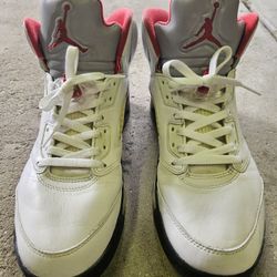 2 Pairs. One Nike Air Jordan 5 Retro Fire Red and Other Jordan 13 Retro.