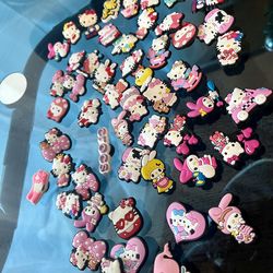 54 Hello kitty croc charms all for $10