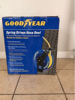 Spring driven hose reel
