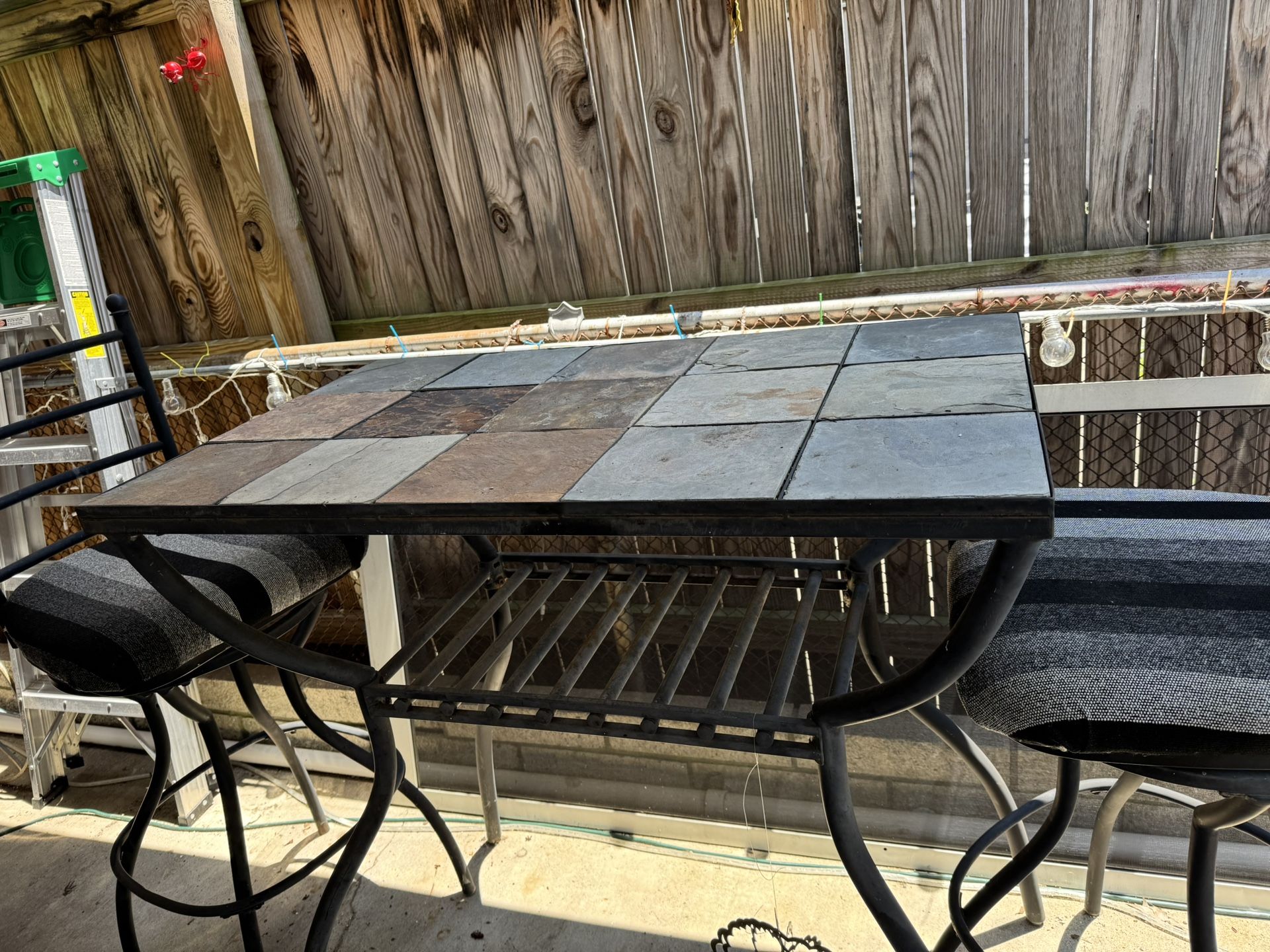 2 Swivel chairs with slate tile High Top table. $125
