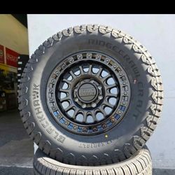 18" KMC rims/ 35" Ridgecrawler AT tires 