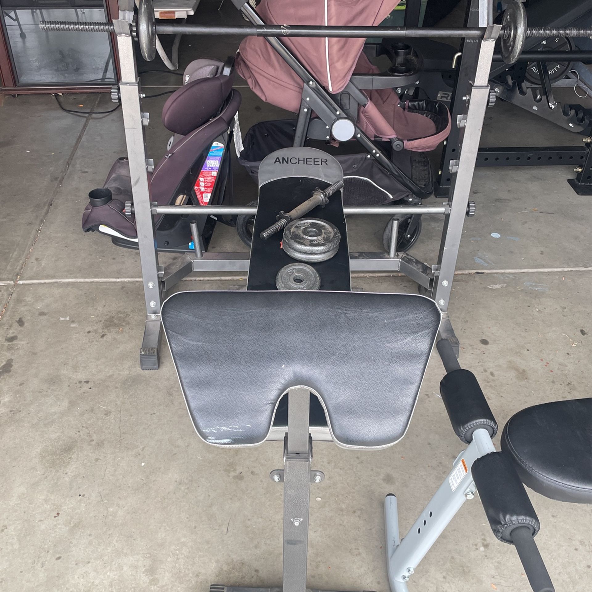 workout bench with weights and small rack