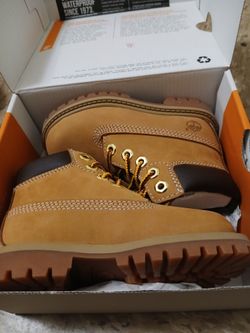 Wheat timberland boots size 10 and black Nike boots size 8c