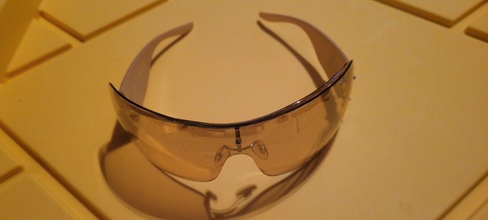 Armani Exchange oversized shield sunglasses with a white or off-white frame and ombré or gradient brown lenses.